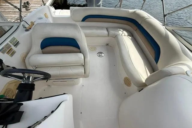 Slide: The Image of 2005 Hurricane SunDeck 217 OB boat interior with white and blue seating. - 10