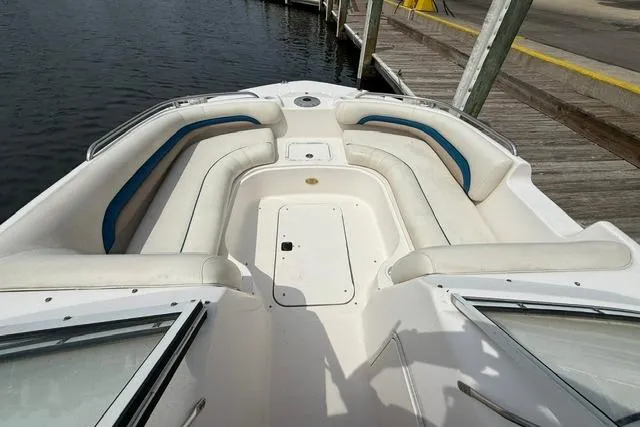 Slide: The Image of 2005 Hurricane SunDeck 217 OB boat with spacious seating at dockside. - 14