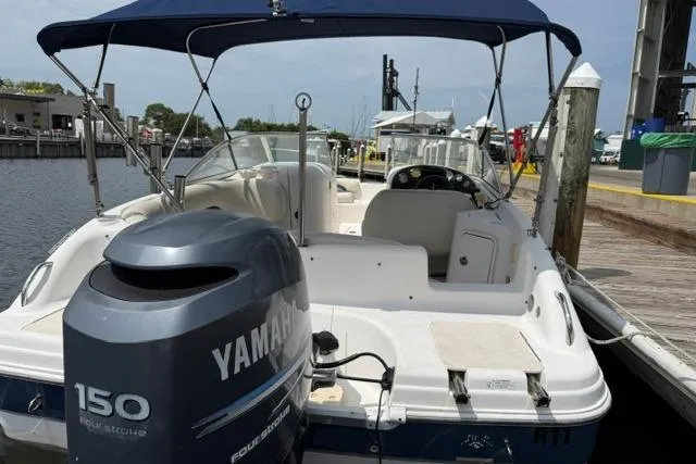 Slide: The Image of 2005 Hurricane SunDeck 217 OB boat docked with Yamaha 150 engine. - 6