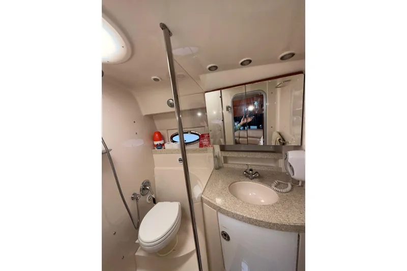 Slide: The Image of 2008 Regal 3760 Sportyacht bathroom with modern fixtures and mirrored cabinets. - 20