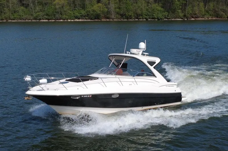 Slide: The Image of 2008 Regal 3760 Sportyacht cruising on a lake. - 3