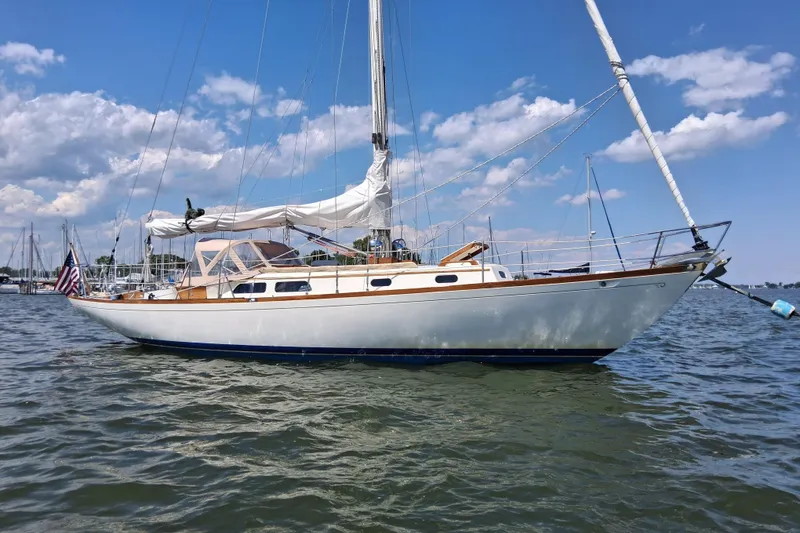 The Image of 1967 Hinckley Pilot 35 sailboat on calm water under a blue sky. - 0