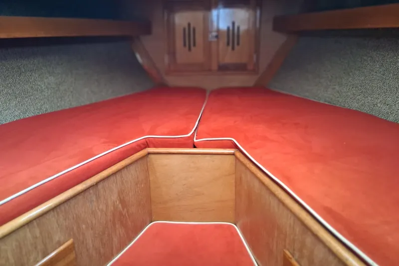 Slide: The Image of Interior cabin of a 1967 Hinckley Pilot 35 sailboat with red cushions. - 17