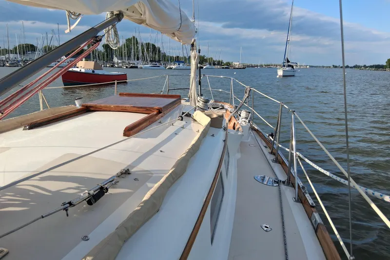 Slide: The Image of Sailboat deck view of 1967 Hinckley Pilot 35 in a marina setting. - 7