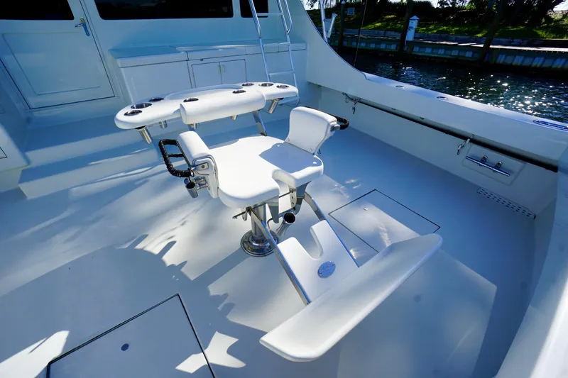 Slide: The Image of Fishing chair on 1991 G&S 58 yacht deck, featuring rod holders and ocean view. - 11