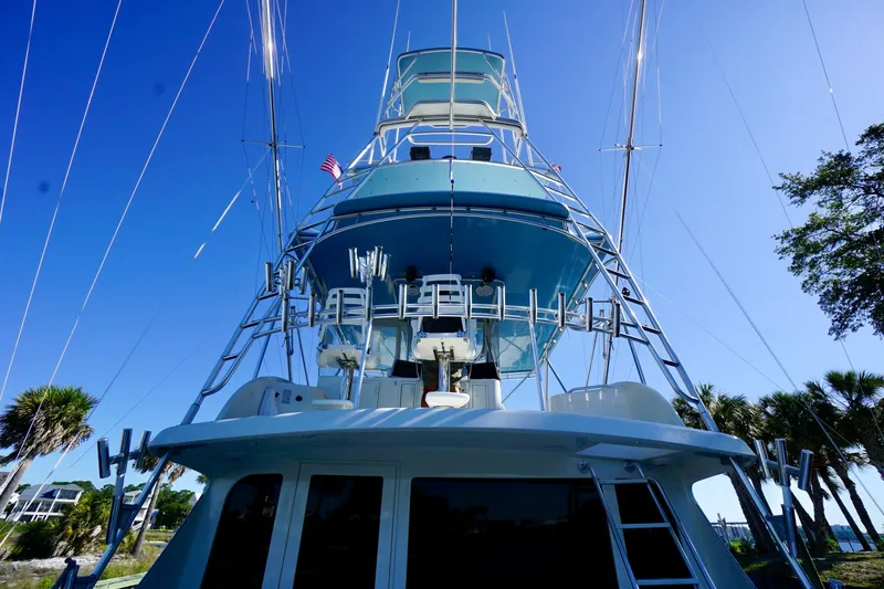 Slide: The Image of 1991 G&S 58 yacht with tall tower against clear blue sky. - 12