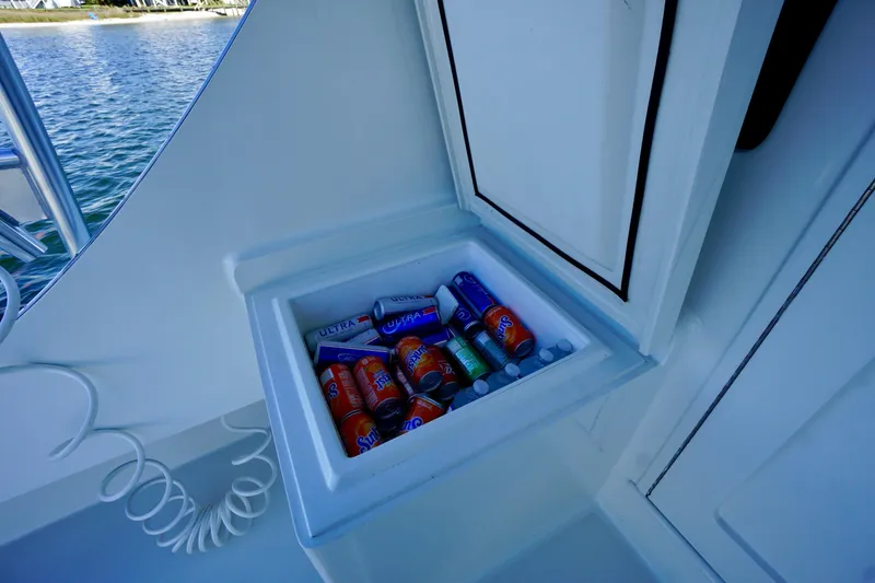 Slide: The Image of Cooler with assorted drinks on a 1991 G&S 58 boat deck. - 13