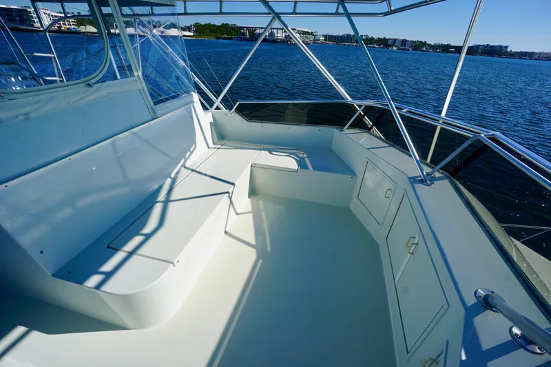 Slide: The Image of Spacious deck of 1991 G&S 58 yacht with seating, overlooking calm waters. - 16
