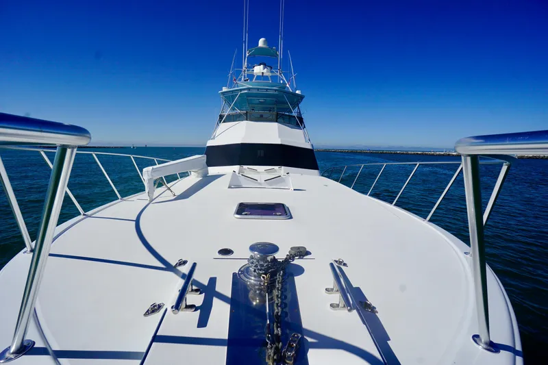 Slide: The Image of 1991 G&S 58 yacht on open water under clear blue sky. - 19