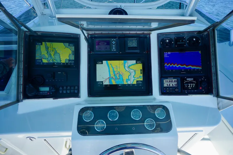 Slide: The Image of Cockpit of 1991 G&S 58 boat with navigation and control panels. - 24