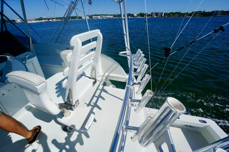Slide: The Image of Fishing boat deck with rod holders, white seating, and ocean view, G&S 58, 1991 model. - 27