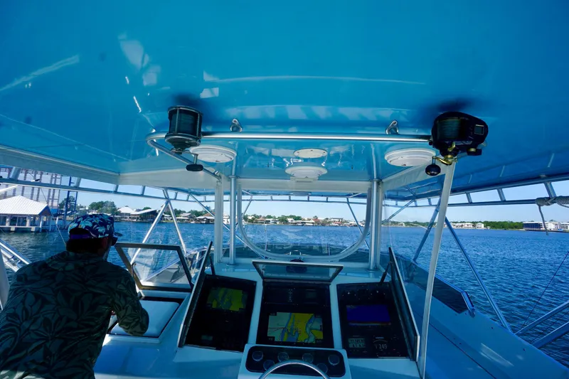Slide: The Image of Cockpit view of a 1991 G&S 58 boat navigating a scenic waterway. - 28