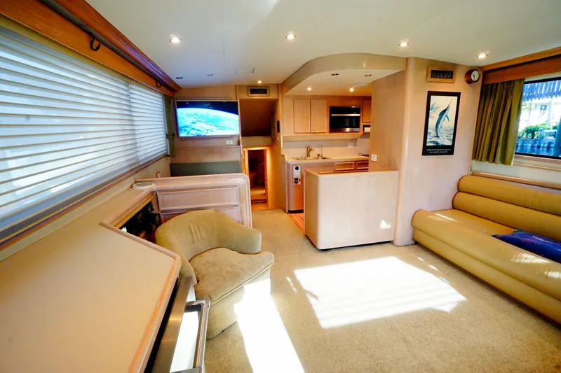 Slide: The Image of Luxurious 1991 G&S 58 yacht interior with modern kitchen, cozy seating, and large windows. - 29