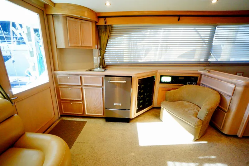 Slide: The Image of Luxurious 1991 G&S 58 yacht interior with modern kitchen and cozy seating area. - 37