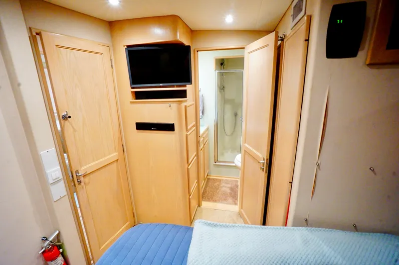 Slide: The Image of Interior of a 1991 G&S 58 yacht cabin with TV and bathroom. - 42