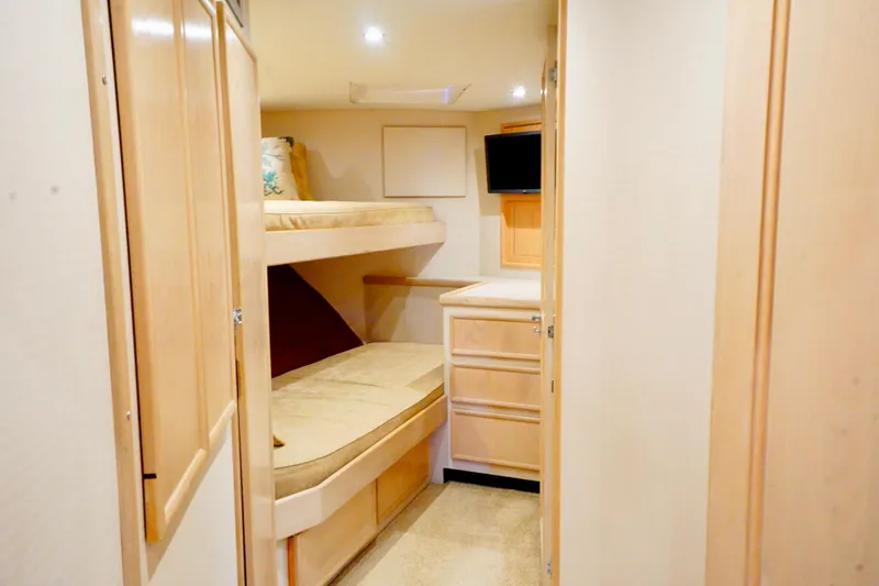 Slide: The Image of Interior of 1991 G&S 58 yacht with cozy bunk beds and wooden cabinetry. - 45