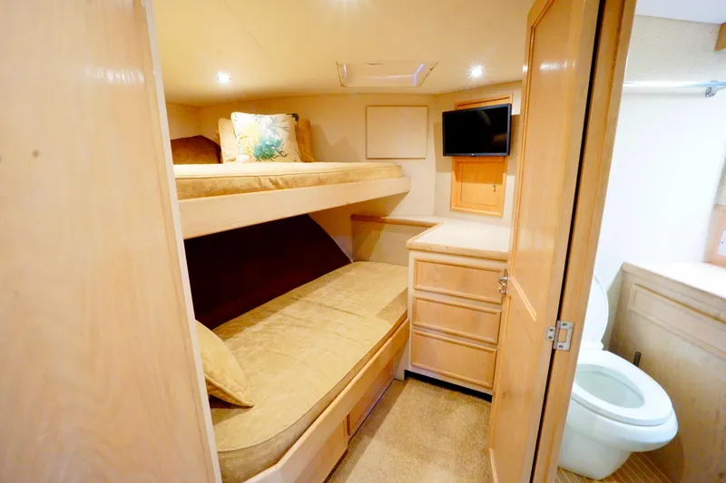 Slide: The Image of Cozy 1991 G&S 58 yacht cabin with bunk beds, TV, and ensuite bathroom. - 47