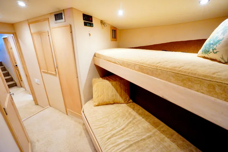 Slide: The Image of Interior of 1991 G&S 58 yacht with cozy bunk beds and soft lighting. - 50