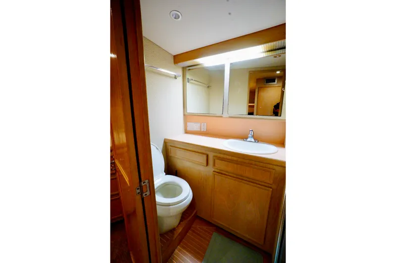 Slide: The Image of Bathroom interior of 1991 G&S 58 yacht with wooden cabinetry and mirror. - 51