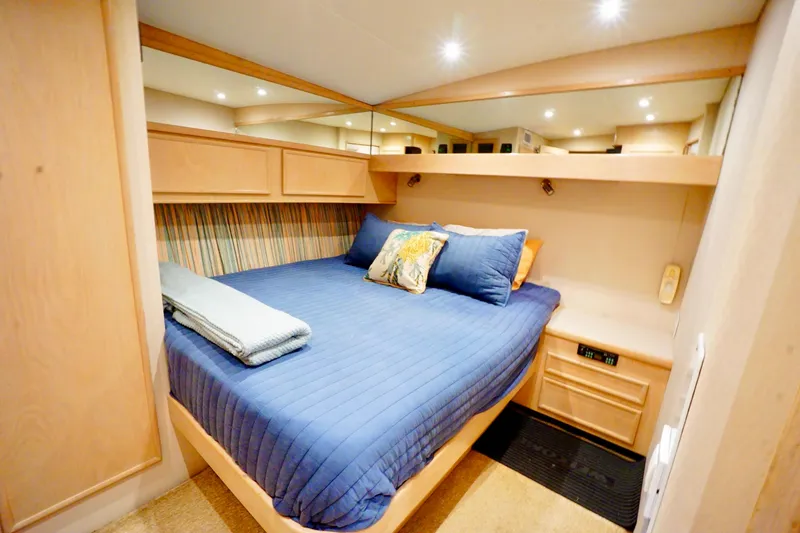 Slide: The Image of Cozy bedroom in 1991 G&S 58 yacht with blue bedding and wooden cabinetry. - 53