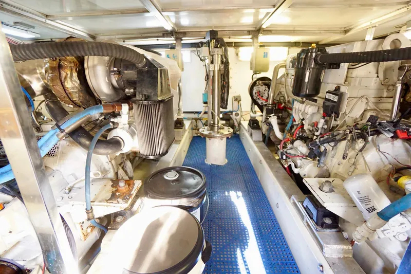 Slide: The Image of Engine room of a 1991 G&S 58 yacht, showcasing mechanical components and piping. - 56