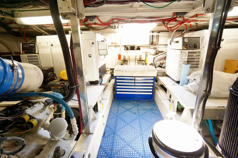 Slide: The Image of Engine room of a 1991 G&S 58 yacht, featuring equipment and storage. - 60
