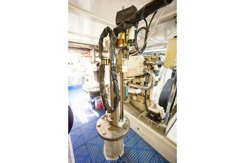 Slide: The Image of Engine room of 1991 G&S 58 boat with mechanical components and blue flooring. - 62