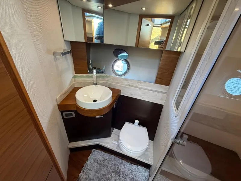 Slide: The Image of 2017 Tiara Yachts C39 Coupe bathroom with sink and toilet. - 15