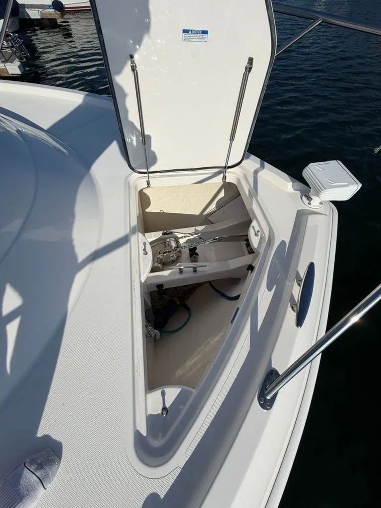 Slide: The Image of Open storage compartment on a 2017 Tiara Yachts C39 Coupe. - 29