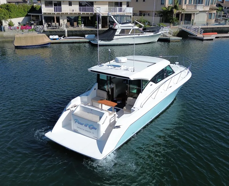 Slide: The Image of 2017 Tiara Yachts C39 Coupe on calm water near dock. - 30