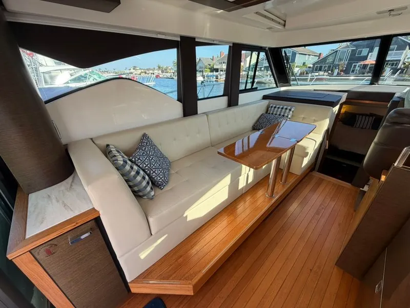 Slide: The Image of Interior of 2017 Tiara Yachts C39 Coupe with sofa and table. - 5
