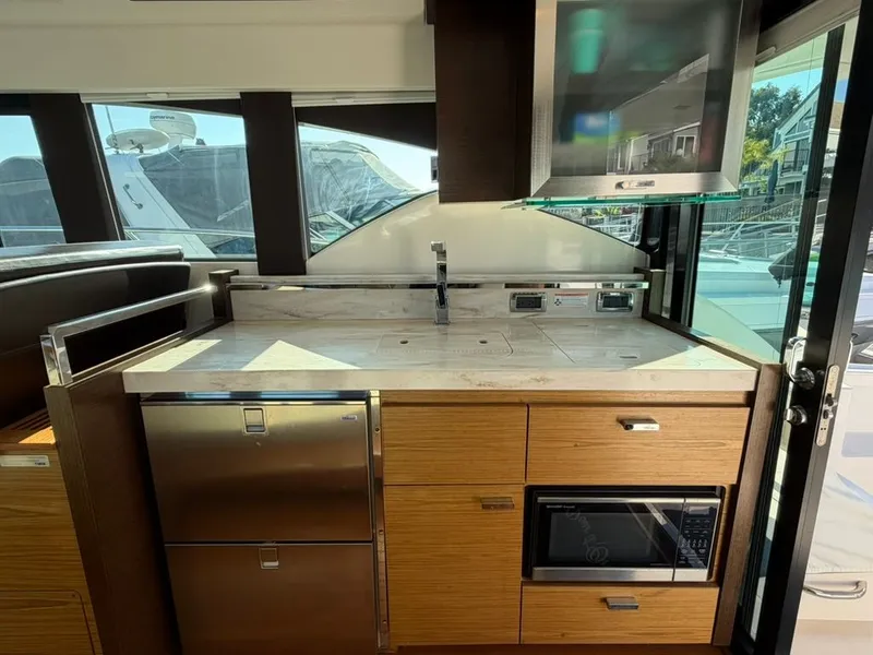 Slide: The Image of Interior of 2017 Tiara Yachts C39 Coupe featuring modern kitchen. - 6