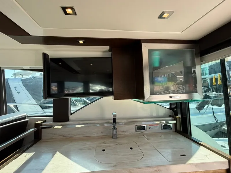 Slide: The Image of Interior of 2017 Tiara Yachts C39 Coupe with TV and sink. - 8