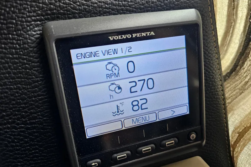 Slide: The Image of Volvo Penta engine display on 2021 Cutwater C-28, showing RPM, hours, and temperature. - 13