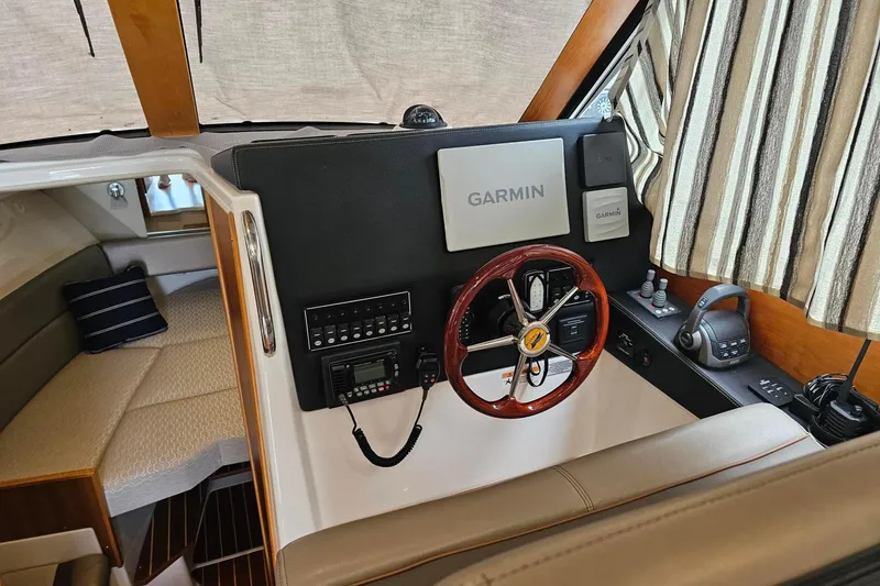 Slide: The Image of 2021 Cutwater C-28 boat interior with Garmin navigation system and cozy cabin area. - 14