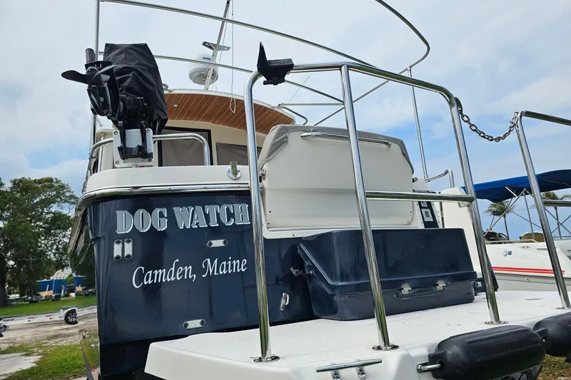 Slide: The Image of 2021 Cutwater C-28 boat named "Dog Watch" from Camden, Maine, docked with clear sky. - 6