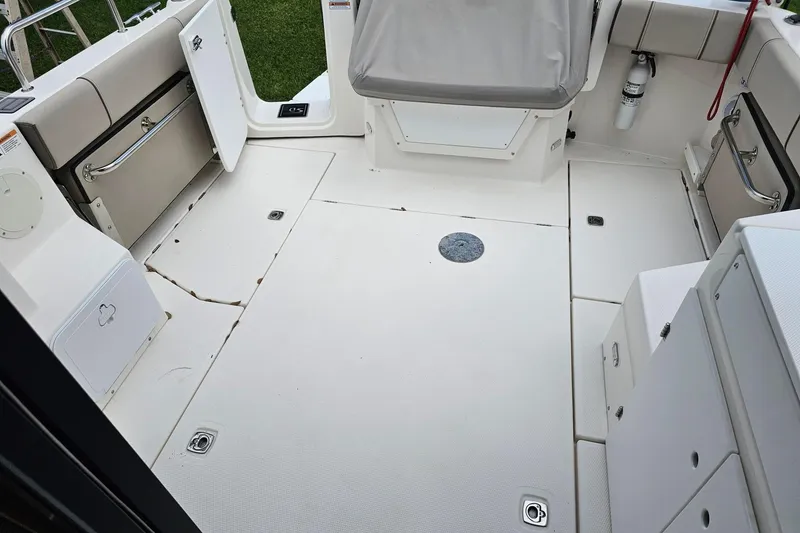 Slide: The Image of 2021 Cutwater C-28 boat interior with spacious deck and seating area. - 7