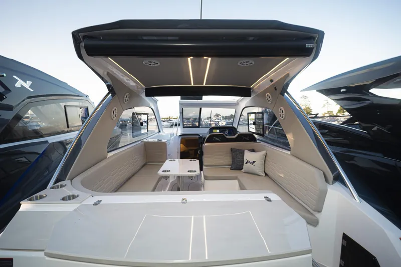 Slide: The Image of Luxurious interior of 2025 NX Boats NX350 MAXIMUS, featuring spacious seating and modern design. - 14