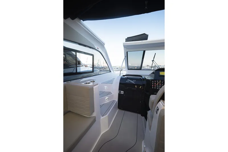 Slide: The Image of Interior view of 2025 NX Boats NX350 MAXIMUS, showcasing modern cockpit design. - 17