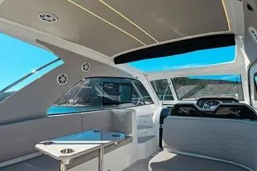 Slide: The Image of Interior of 2025 NX Boats NX350 MAXIMUS, featuring modern seating and sleek design. - 2