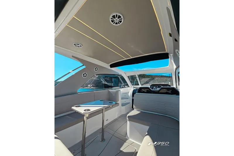 Slide: The Image of Luxurious interior of 2025 NX Boats NX350 MAXIMUS with modern seating and sleek design. - 20