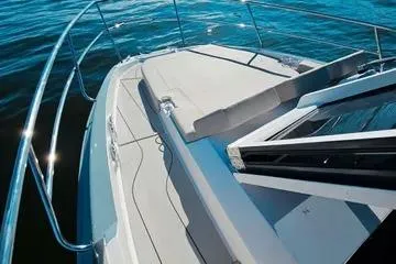 Slide: The Image of 2025 NX Boats NX350 MAXIMUS deck view on water. - 5