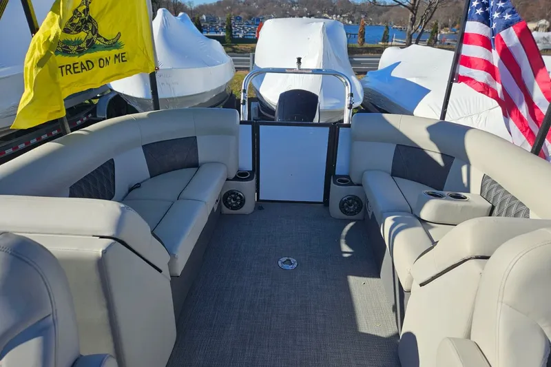Slide: The Image of Interior of a 2021 Crest 220 DLX pontoon boat with flags. - 8
