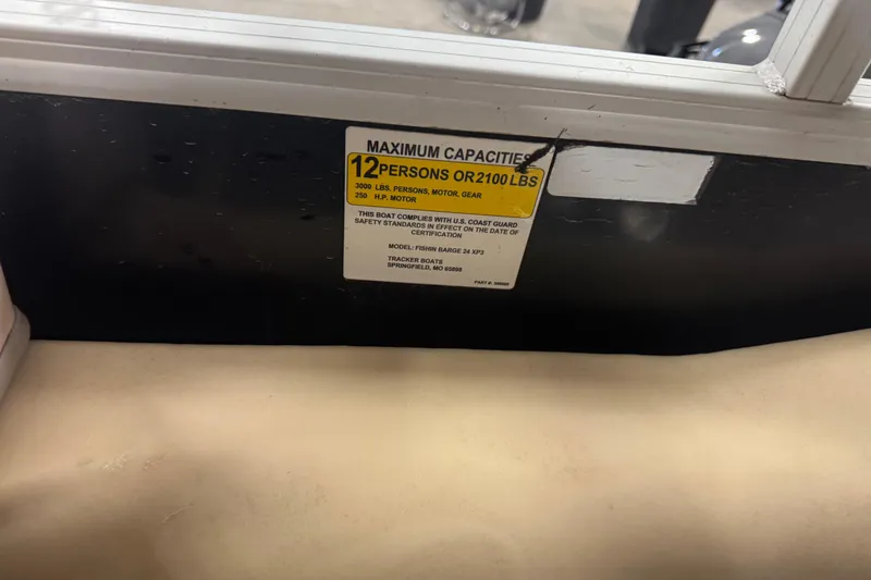 Slide: The Image of 2018 Sun Tracker Fishin' Barge 24 XP3 capacity label, 12 persons or 2100 lbs. - 13