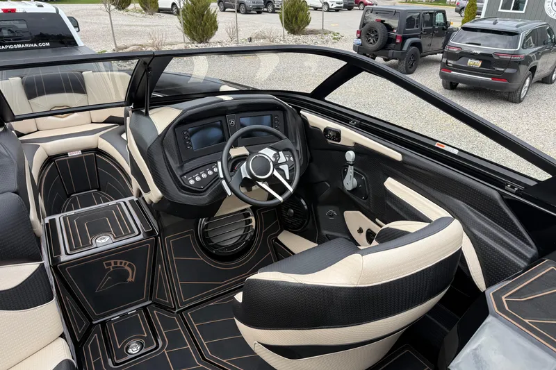 Slide: The Image of Interior of a 2019 Centurion Ri257 boat with modern dashboard and seating. - 13