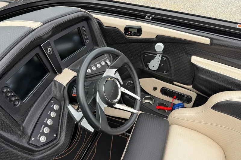 Slide: The Image of Interior of a 2019 Centurion Ri257 boat, featuring a modern dashboard and steering wheel. - 14