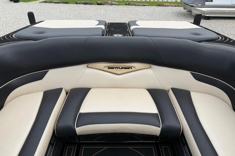 Slide: The Image of 2019 Centurion Ri257 boat interior with luxurious black and beige seating. - 15