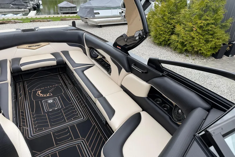 Slide: The Image of 2019 Centurion Ri257 boat interior with luxurious seating and sleek design. - 18