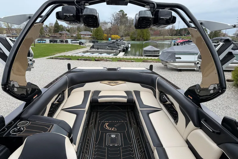 Slide: The Image of 2019 Centurion Ri257 boat interior with luxurious seating and advanced audio system. - 19