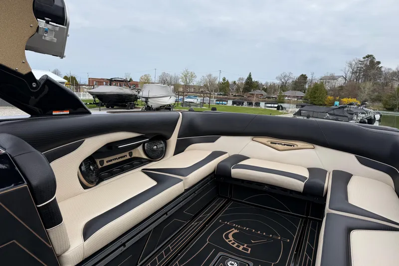 Slide: The Image of 2019 Centurion Ri257 boat interior with luxurious seating and modern design. - 20